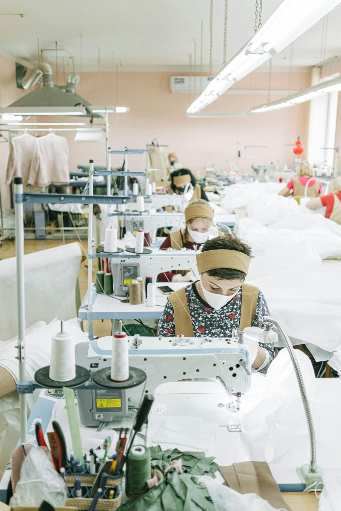 pexels-photo-4492119-4492119 Women working with sewing machines in a textile factory, focused on production.